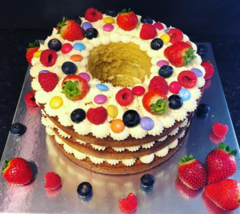 Vanilla Cake topped with Berries and Smarties